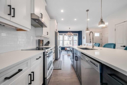 19 Marquis Gardens Se, Calgary, AB - Indoor Photo Showing Kitchen With Double Sink With Upgraded Kitchen