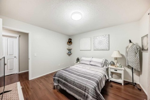 719 Panamount Boulevard Nw, Calgary, AB - Indoor Photo Showing Bedroom