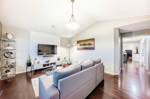 719 Panamount Boulevard Nw, Calgary, AB - Indoor Photo Showing Living Room
