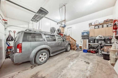 719 Panamount Boulevard Nw, Calgary, AB - Indoor Photo Showing Garage