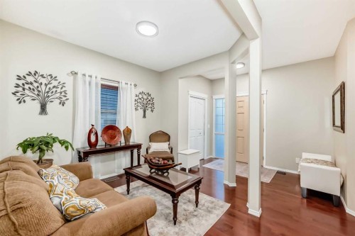 719 Panamount Boulevard Nw, Calgary, AB - Indoor Photo Showing Living Room