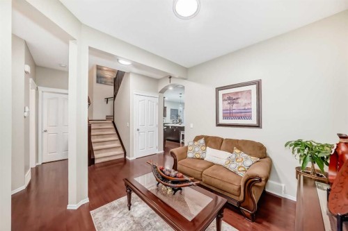719 Panamount Boulevard Nw, Calgary, AB - Indoor Photo Showing Living Room