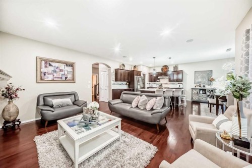 719 Panamount Boulevard Nw, Calgary, AB - Indoor Photo Showing Living Room