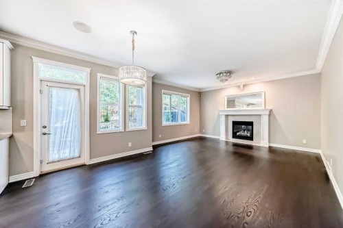 173 Aspenshire Drive Sw, Calgary, AB - Indoor Photo Showing Living Room With Fireplace