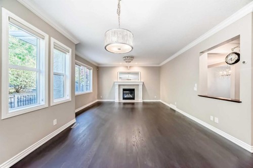 173 Aspenshire Drive Sw, Calgary, AB - Indoor Photo Showing Living Room With Fireplace
