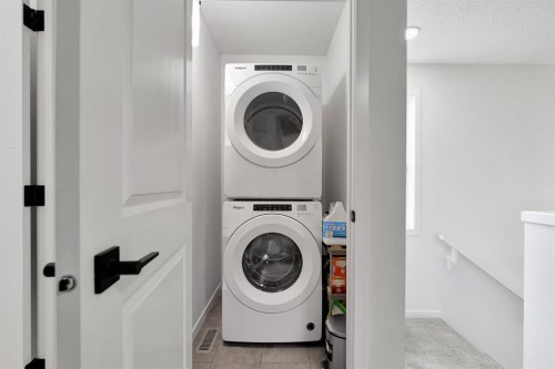 179 Willow Place, Cochrane, AB - Indoor Photo Showing Laundry Room