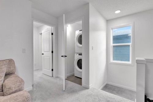 179 Willow Place, Cochrane, AB - Indoor Photo Showing Laundry Room