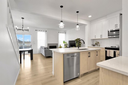 179 Willow Place, Cochrane, AB - Indoor Photo Showing Kitchen With Upgraded Kitchen