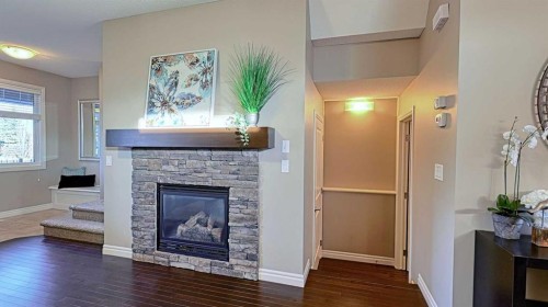 12 Legacy Gate Se, Calgary, AB - Indoor Photo Showing Living Room With Fireplace