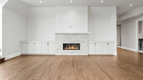 502-221 Quarry Way Se, Calgary, AB - Indoor Photo Showing Living Room With Fireplace