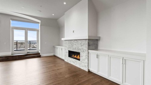 502-221 Quarry Way Se, Calgary, AB - Indoor With Fireplace