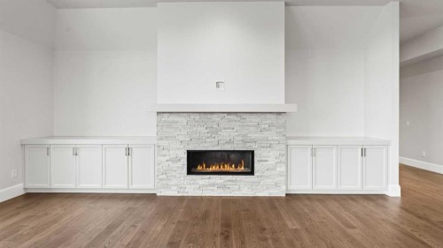 502-221 Quarry Way Se, Calgary, AB - Indoor Photo Showing Living Room With Fireplace