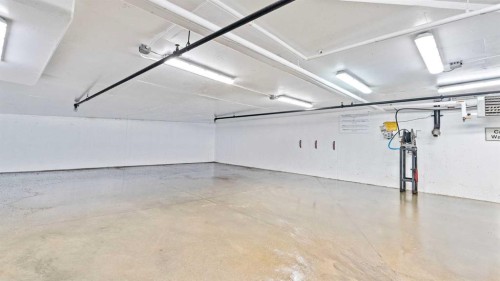 502-221 Quarry Way Se, Calgary, AB - Indoor Photo Showing Garage