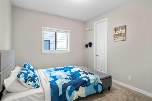29 Magnolia Manor Se, Calgary, AB - Indoor Photo Showing Bedroom
