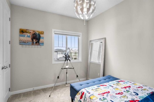 29 Magnolia Manor Se, Calgary, AB - Indoor Photo Showing Bedroom