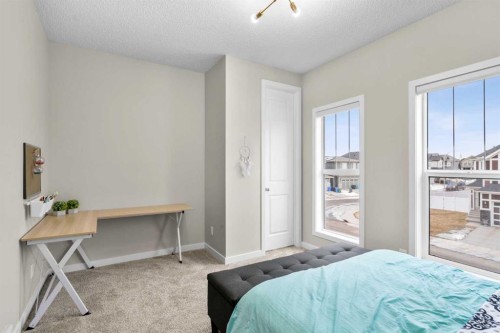 29 Magnolia Manor Se, Calgary, AB - Indoor Photo Showing Bedroom