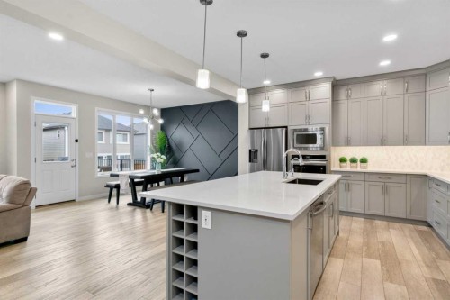 29 Magnolia Manor Se, Calgary, AB - Indoor Photo Showing Kitchen With Upgraded Kitchen