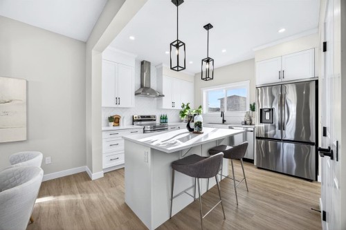 355 Fireside Drive Nw, Cochrane, AB - Indoor Photo Showing Kitchen With Stainless Steel Kitchen With Upgraded Kitchen