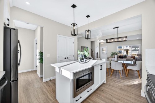 355 Fireside Drive Nw, Cochrane, AB - Indoor Photo Showing Kitchen With Upgraded Kitchen