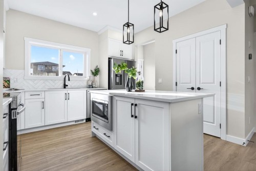 355 Fireside Drive Nw, Cochrane, AB - Indoor Photo Showing Kitchen With Upgraded Kitchen