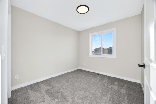 355 Fireside Drive Nw, Cochrane, AB - Indoor Photo Showing Other Room