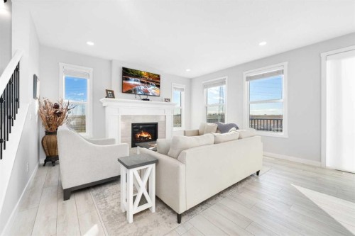 141 Boulder Creek Place, Langdon, AB - Indoor Photo Showing Living Room With Fireplace
