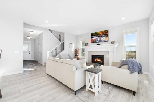 141 Boulder Creek Place, Langdon, AB - Indoor Photo Showing Living Room With Fireplace