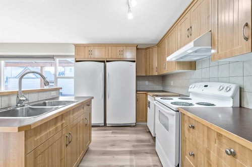 216 West Creek Close, Chestermere, AB - Indoor Photo Showing Kitchen With Double Sink