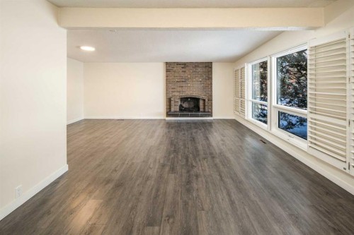 4712 Vegas Road Nw, Calgary, AB - Indoor Photo Showing Living Room With Fireplace