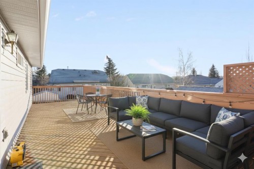 165 Quigley Drive, Cochrane, AB - Outdoor With Deck Patio Veranda With Exterior