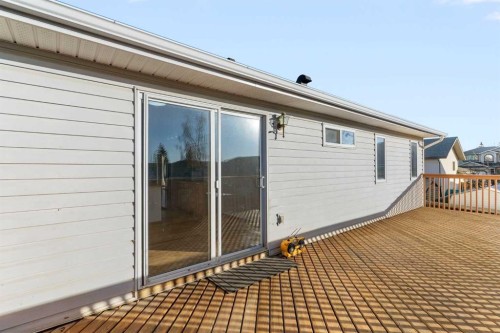 165 Quigley Drive, Cochrane, AB - Outdoor With Deck Patio Veranda With Exterior