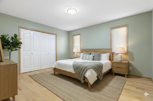 165 Quigley Drive, Cochrane, AB - Indoor Photo Showing Bedroom