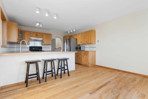 165 Quigley Drive, Cochrane, AB - Indoor Photo Showing Kitchen