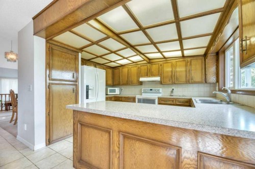 77 Edgewood Rise Nw, Calgary, AB - Indoor Photo Showing Kitchen With Double Sink