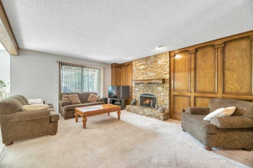 77 Edgewood Rise Nw, Calgary, AB - Indoor Photo Showing Living Room With Fireplace