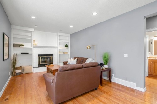 16 Woodacres Drive Sw, Calgary, AB - Indoor Photo Showing Living Room With Fireplace