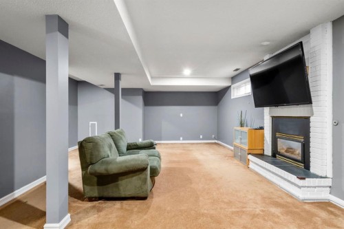 16 Woodacres Drive Sw, Calgary, AB - Indoor With Fireplace