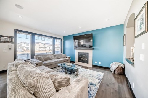 16 Skyview Shores Gardens Ne, Calgary, AB - Indoor Photo Showing Living Room With Fireplace