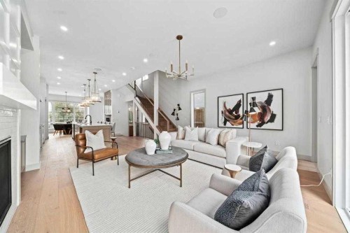 2533 2 Avenue Nw, Calgary, AB - Indoor Photo Showing Living Room With Fireplace
