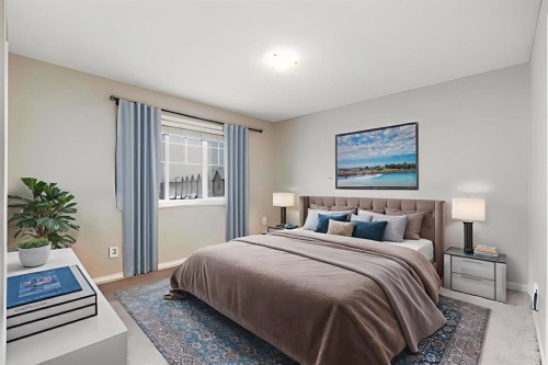 504-620 Luxstone Landing Sw, Airdrie, AB - Indoor Photo Showing Bedroom