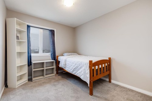 504-620 Luxstone Landing Sw, Airdrie, AB - Indoor Photo Showing Bedroom