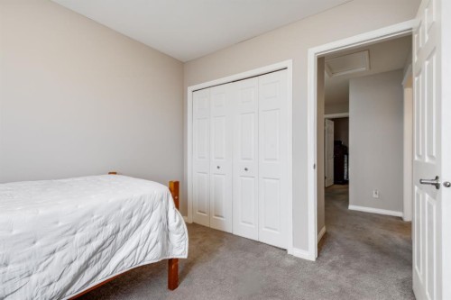 504-620 Luxstone Landing Sw, Airdrie, AB - Indoor Photo Showing Bedroom