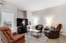 504-620 Luxstone Landing Sw, Airdrie, AB  - Indoor Photo Showing Living Room 