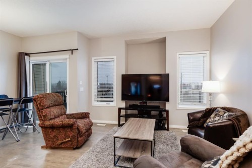 504-620 Luxstone Landing Sw, Airdrie, AB - Indoor Photo Showing Living Room