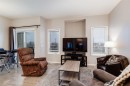 504-620 Luxstone Landing Sw, Airdrie, AB  - Indoor Photo Showing Living Room 