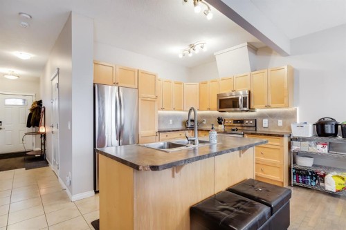504-620 Luxstone Landing Sw, Airdrie, AB - Indoor Photo Showing Kitchen With Double Sink
