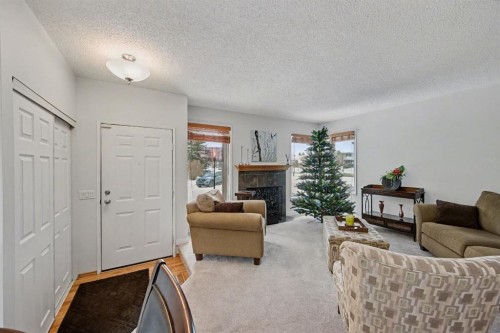 34 Woodglen Crescent Sw, Calgary, AB - Indoor Photo Showing Living Room With Fireplace