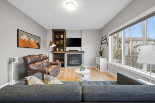 136 Wildrose Crescent, Strathmore, AB - Indoor Photo Showing Living Room With Fireplace