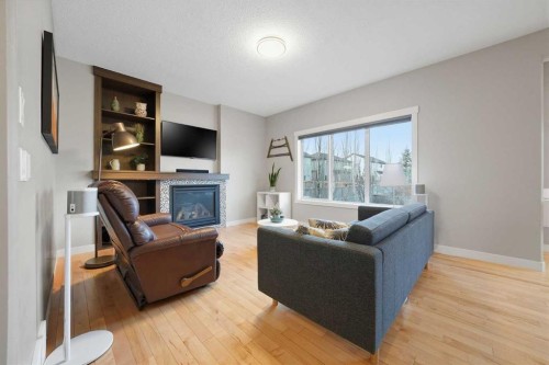 136 Wildrose Crescent, Strathmore, AB - Indoor Photo Showing Living Room With Fireplace