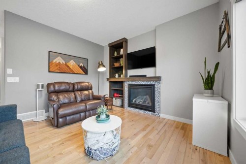 136 Wildrose Crescent, Strathmore, AB - Indoor Photo Showing Living Room With Fireplace